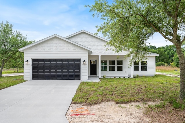 3645 Frederick Ave, Bell, FL 32619 - single story home with an attached garage, driveway, and a front lawn