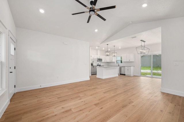 3645 Frederick Ave, Bell, FL 32619 - unfurnished living room featuring a chandelier, ceiling fan, light wood finished floors, vaulted ceiling, and recessed lighting