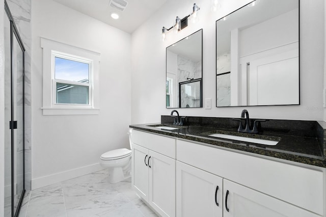 3645 Frederick Ave, Bell, FL 32619 - bathroom featuring marble look tiles, a marble finish shower, baseboards, toilet, and double vanity