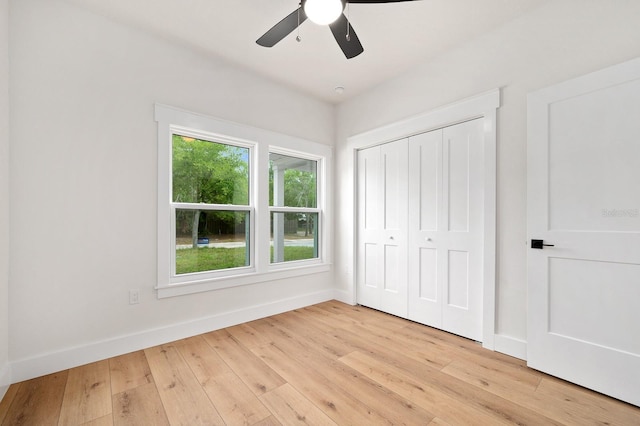 3645 Frederick Ave, Bell, FL 32619 - unfurnished bedroom featuring light wood-style flooring, baseboards, a closet, and ceiling fan