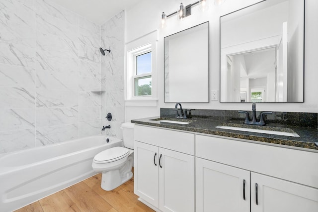 3645 Frederick Ave, Bell, FL 32619 - full bath featuring toilet, wood finished floors, bathing tub / shower combination, and double vanity