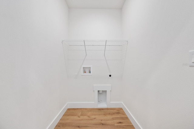 3645 Frederick Ave, Bell, FL 32619 - laundry area featuring electric dryer hookup, hookup for a washing machine, light wood finished floors, and baseboards