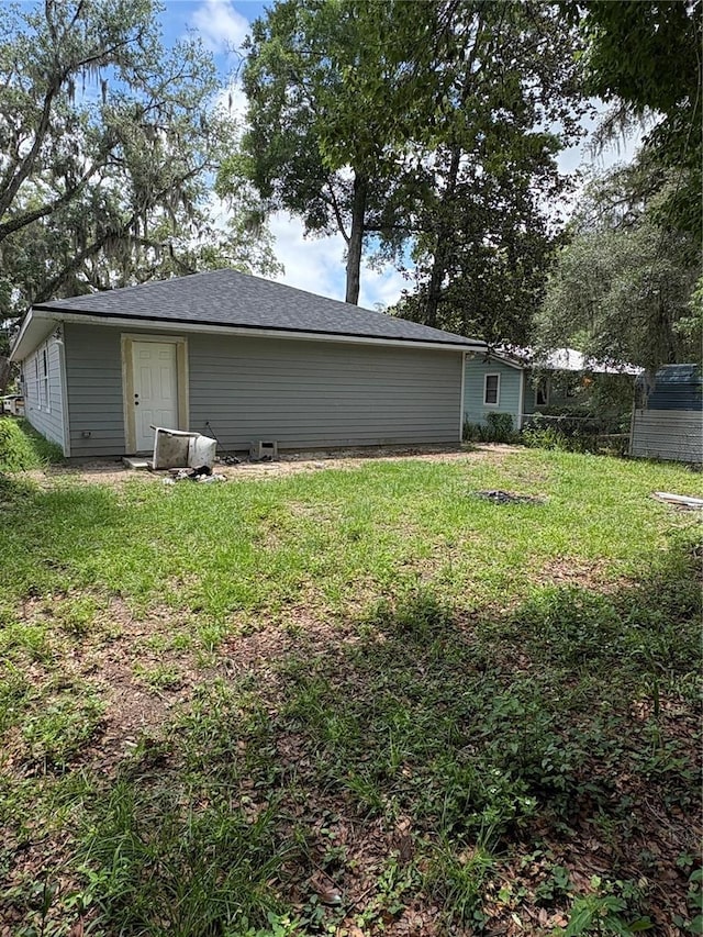 1312 NE 1st Ave, Gainesville, FL 32641 - view of side of property featuring a lawn