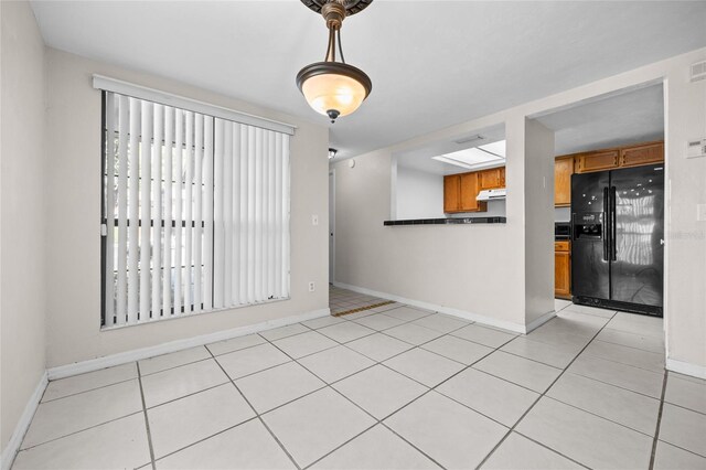 5841 SW 8th Pl, Gainesville, FL 32607 - empty room featuring baseboards and light tile patterned flooring