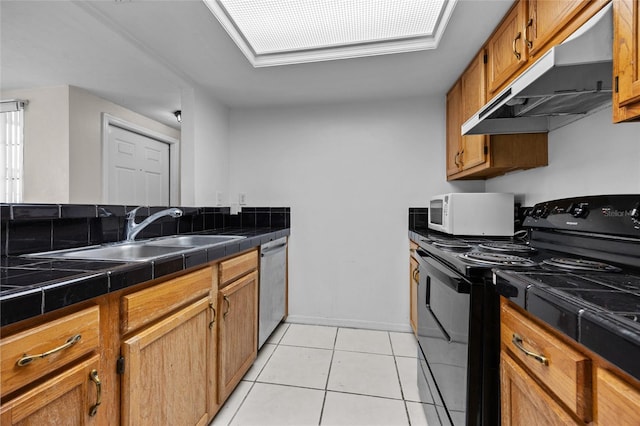 5841 SW 8th Pl, Gainesville, FL 32607 - kitchen with black electric range oven, under cabinet range hood, white microwave, a sink, and dishwasher