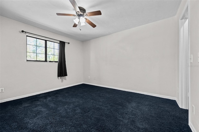 5841 SW 8th Pl, Gainesville, FL 32607 - spare room with dark carpet, ceiling fan, and baseboards