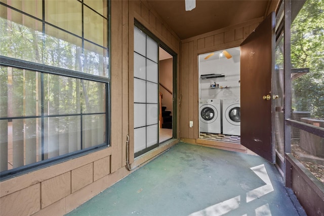 5841 SW 8th Pl, Gainesville, FL 32607 - unfurnished sunroom featuring washing machine and clothes dryer