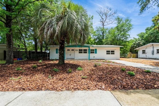 2911 NE 17th Ter, Gainesville, FL 32609 - ranch-style home with fence and a porch