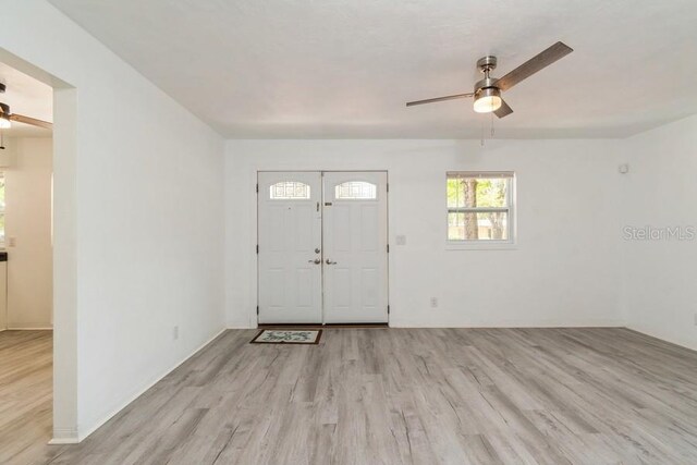 2911 NE 17th Ter, Gainesville, FL 32609 - foyer with a ceiling fan and light wood-style flooring