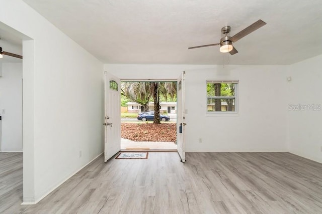 2911 NE 17th Ter, Gainesville, FL 32609 - entryway with a ceiling fan, wood finished floors, and plenty of natural light