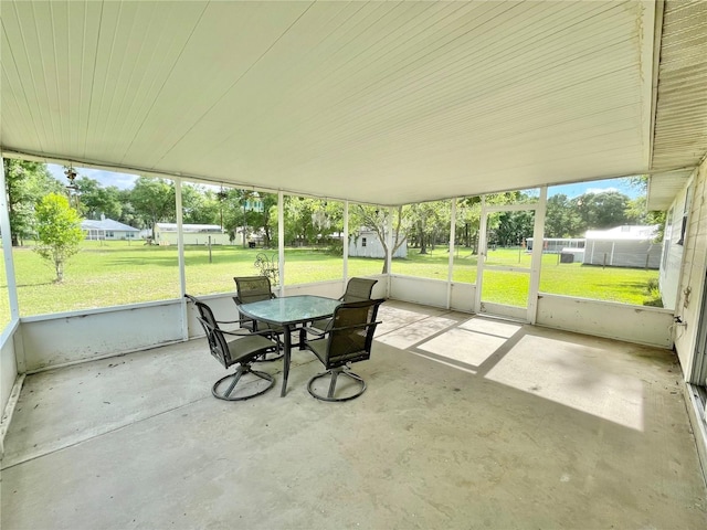 24409 NW 25th Pl, Newberry, FL 32669 - sunroom featuring outdoor dining area