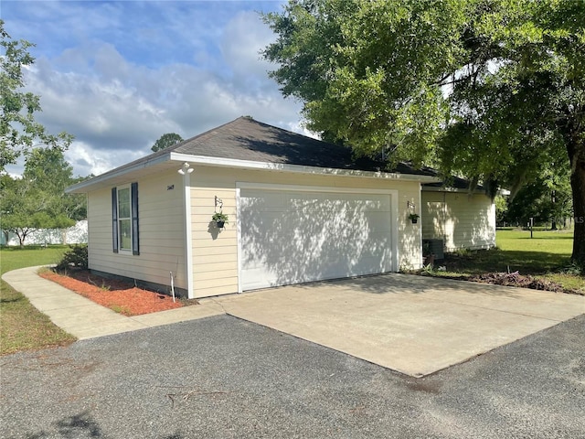 24409 NW 25th Pl, Newberry, FL 32669 - view of home's exterior with a yard and driveway