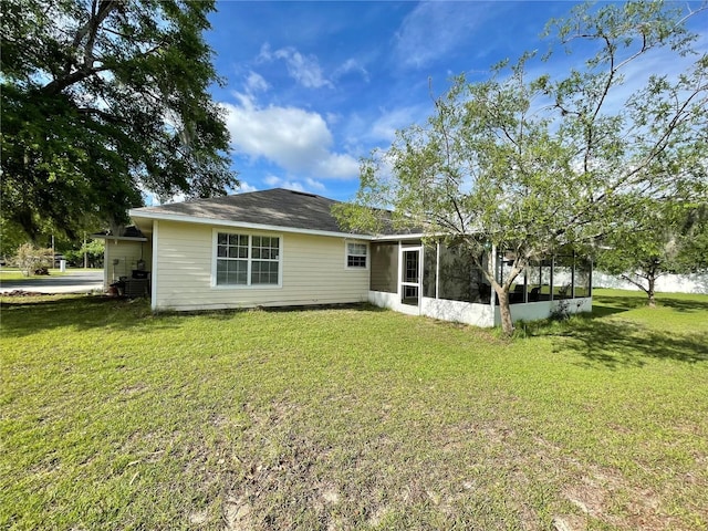 24409 NW 25th Pl, Newberry, FL 32669 - rear view of property featuring a sunroom and a yard