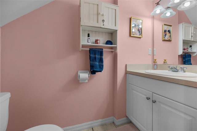 2636 SW 35th Pl Unit 21, Gainesville, FL 32608 - bathroom with toilet, vanity, and baseboards