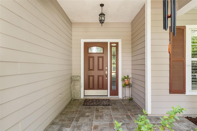 1979 NW 86th Ter, Gainesville, FL 32606 - doorway to property featuring covered porch