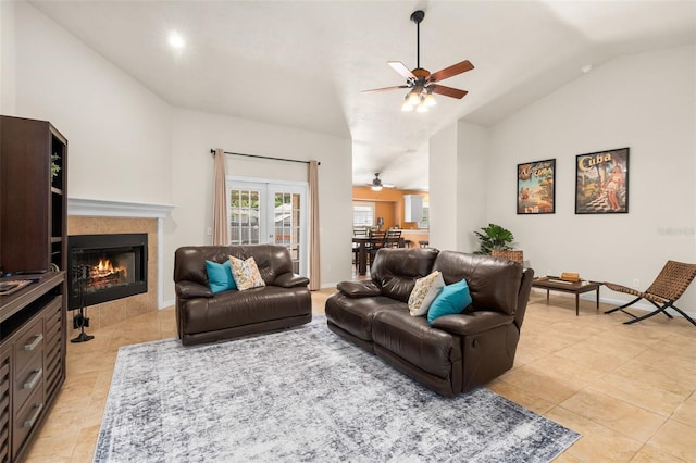 1979 NW 86th Ter, Gainesville, FL 32606 - living room featuring ceiling fan, lofted ceiling, light tile patterned flooring, a tile fireplace, and recessed lighting