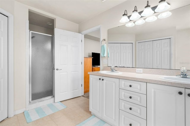 1979 NW 86th Ter, Gainesville, FL 32606 - full bath featuring a shower stall, double vanity, tile patterned flooring, and a closet