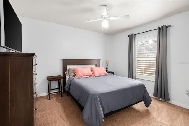 1979 NW 86th Ter, Gainesville, FL 32606 - bedroom with light colored carpet, baseboards, and a ceiling fan