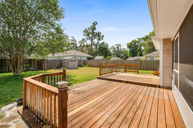 1979 NW 86th Ter, Gainesville, FL 32606 - wooden terrace featuring a storage unit and an outbuilding