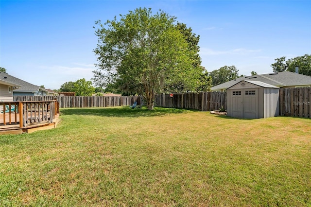 1979 NW 86th Ter, Gainesville, FL 32606 - view of yard featuring a shed, an outdoor structure, and a wooden deck