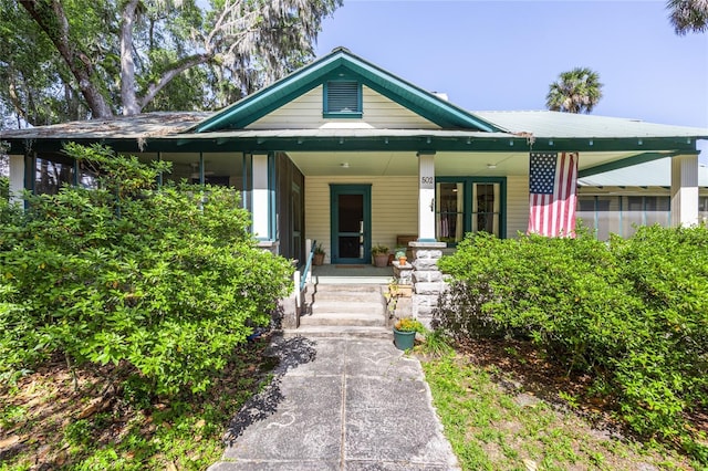 502 NE Cholokka Blvd, Micanopy, FL 32667 - view of front of property featuring covered porch