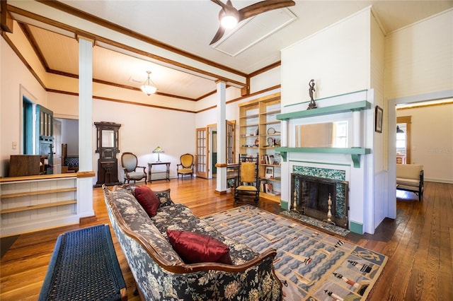 502 NE Cholokka Blvd, Micanopy, FL 32667 - living room with hardwood / wood-style flooring, crown molding, and a high end fireplace