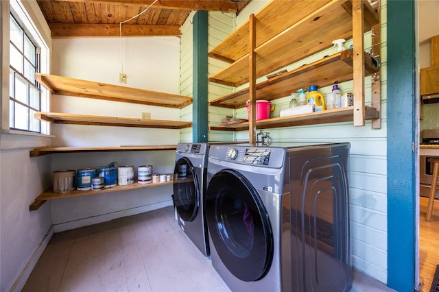 502 NE Cholokka Blvd, Micanopy, FL 32667 - laundry area with washing machine and clothes dryer, wood finished floors, and wooden ceiling