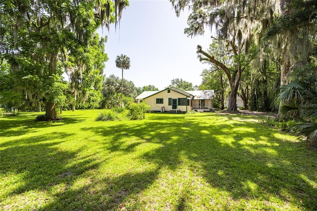 502 NE Cholokka Blvd, Micanopy, FL 32667 - view of green lawn