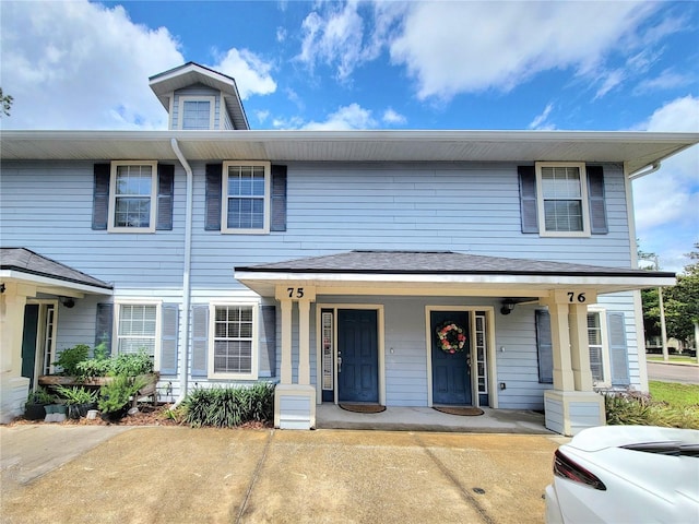 2964 SW 35th Pl Unit 75, Gainesville, FL 32608 - townhome / multi-family property with covered porch and cooling unit