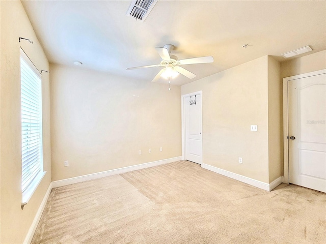 2964 SW 35th Pl Unit 75, Gainesville, FL 32608 - empty room with light colored carpet, a ceiling fan, and baseboards