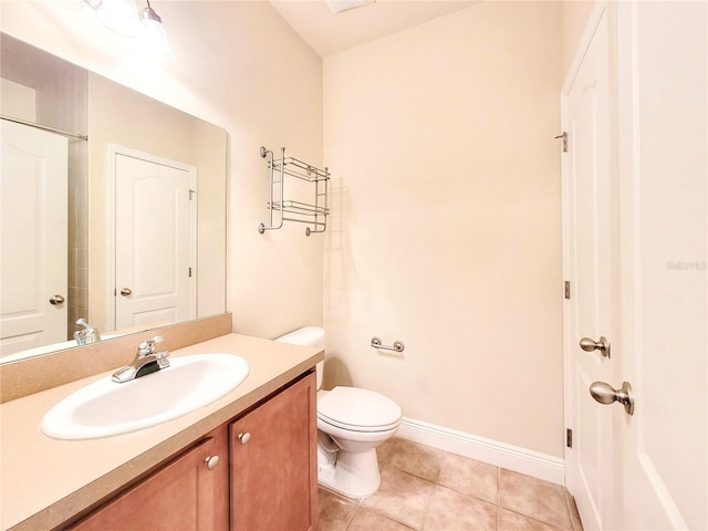2964 SW 35th Pl Unit 75, Gainesville, FL 32608 - bathroom with toilet, vanity, tile patterned flooring, and baseboards