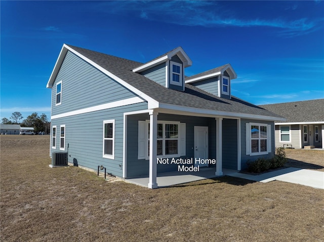 3279 E Iris Ln, Bell, FL 32619 - rear view of property with covered porch, central air condition unit, a shingled roof, and a lawn