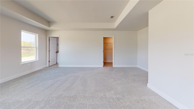 3279 E Iris Ln, Bell, FL 32619 - empty room with a tray ceiling, light colored carpet, and baseboards