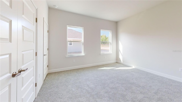 3279 E Iris Ln, Bell, FL 32619 - spare room featuring light carpet, baseboards, and a smoke detector