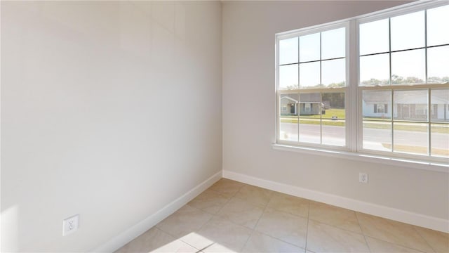 3279 E Iris Ln, Bell, FL 32619 - unfurnished room featuring baseboards and light tile patterned flooring