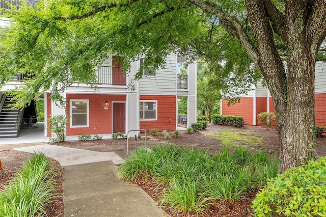 2360 SW Archer Rd Unit 1102, Gainesville, FL 32608 - view of front of house featuring a balcony and covered porch