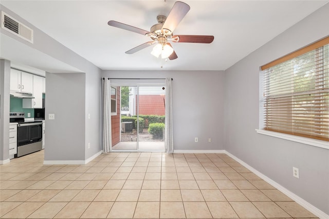 2360 SW Archer Rd Unit 1102, Gainesville, FL 32608 - unfurnished room with ceiling fan, baseboards, and light tile patterned flooring
