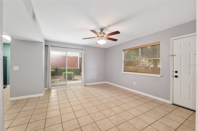 2360 SW Archer Rd Unit 1102, Gainesville, FL 32608 - spare room featuring ceiling fan and baseboards