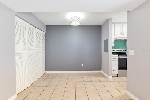 2360 SW Archer Rd Unit 1102, Gainesville, FL 32608 - kitchen featuring electric range, under cabinet range hood, white cabinetry, light tile patterned flooring, and electric panel