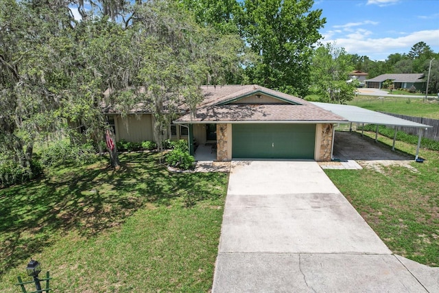 1786 S Border Ave, Inverness, FL 34452 - view of front of property featuring a front yard, a garage, driveway, and a carport