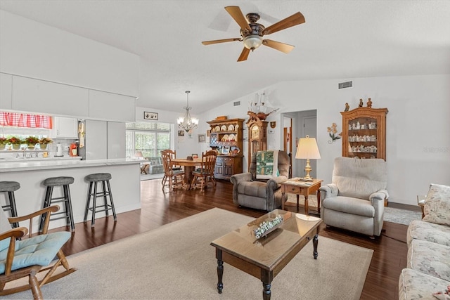 1786 S Border Ave, Inverness, FL 34452 - living room featuring lofted ceiling, a chandelier, dark wood-type flooring, and a ceiling fan