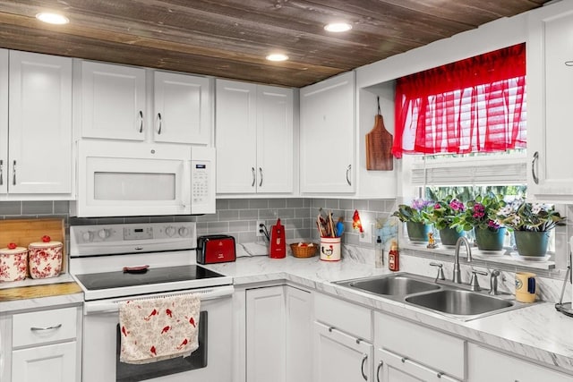 1786 S Border Ave, Inverness, FL 34452 - kitchen with white appliances, a sink, light countertops, wooden ceiling, and recessed lighting