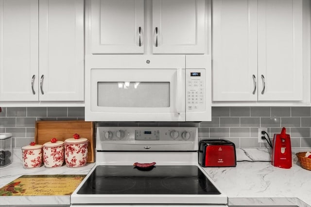 1786 S Border Ave, Inverness, FL 34452 - kitchen featuring white appliances, backsplash, and white cabinets