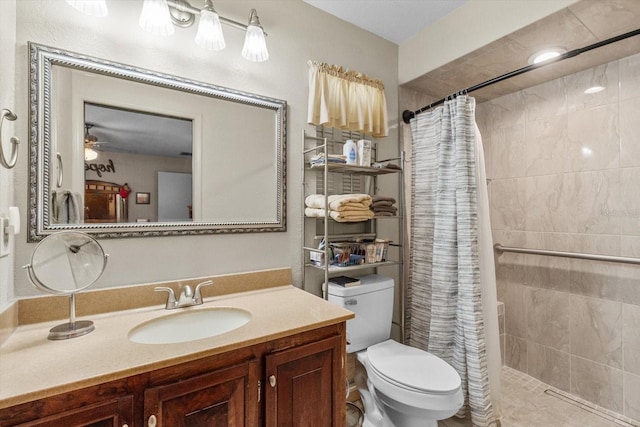 1786 S Border Ave, Inverness, FL 34452 - bathroom with toilet, tiled shower, vanity, and ceiling fan