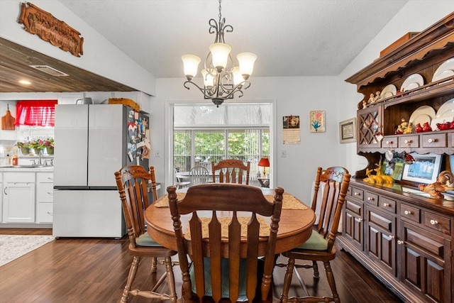 1786 S Border Ave, Inverness, FL 34452 - dining area with a chandelier and dark wood finished floors