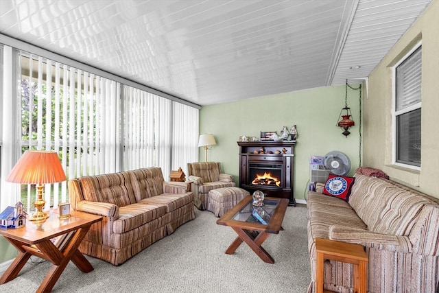 1786 S Border Ave, Inverness, FL 34452 - carpeted living area featuring a lit fireplace