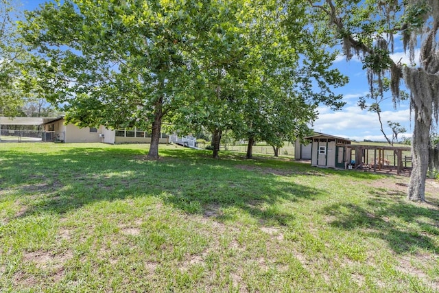 1786 S Border Ave, Inverness, FL 34452 - view of yard featuring an outdoor structure and a storage unit