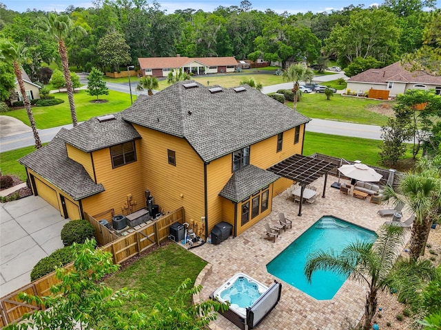 view of pool with cooling unit and a patio area