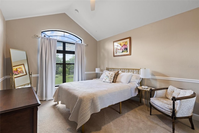 bedroom featuring carpet, ceiling fan, and high vaulted ceiling