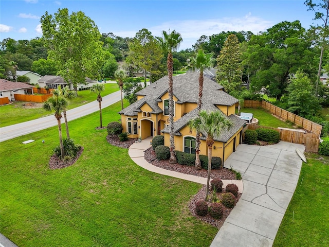 view of front of property with stucco siding, driveway, and an attached garage